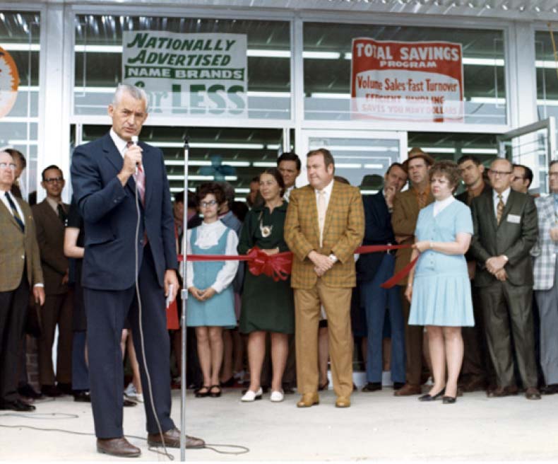 Sam Walton speaks to the community at opening of the first Walmart in Rogers, Arkansas.