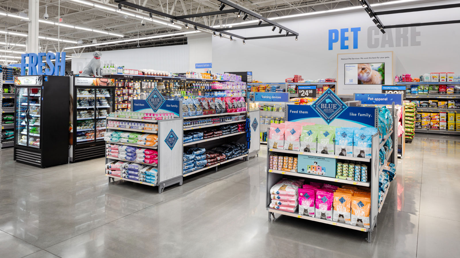Pet department of Walmart store of the future showing aisles of pet food.