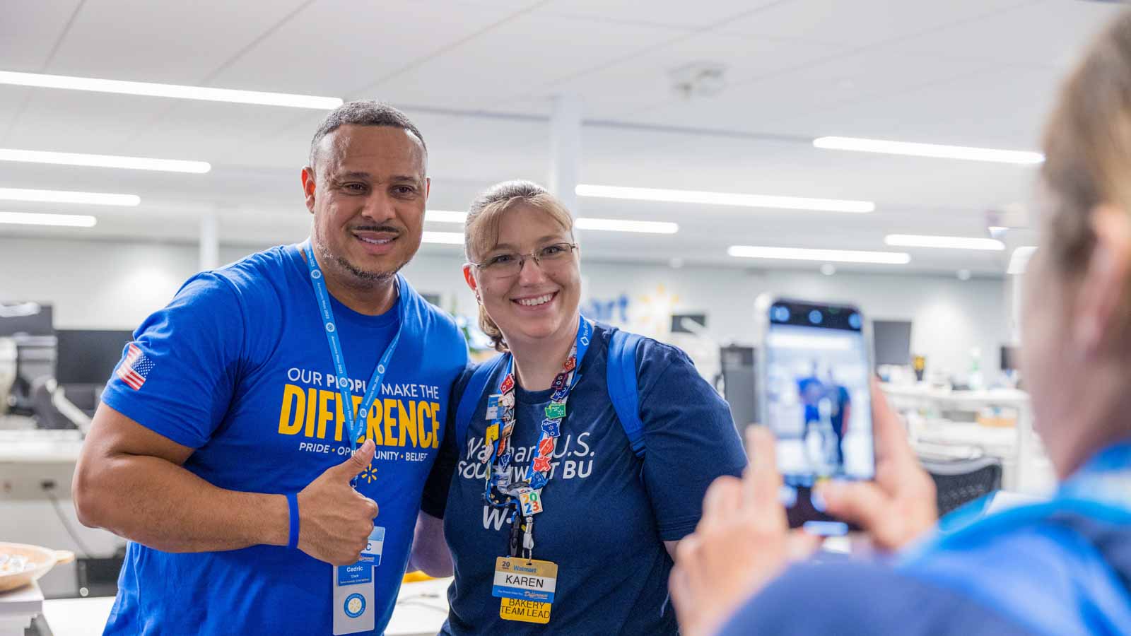 A female visiting associate meets Cedric Clark, Executive Vice President of Store Operations for Walmart U.S., during her Walmart Home Office tour.
