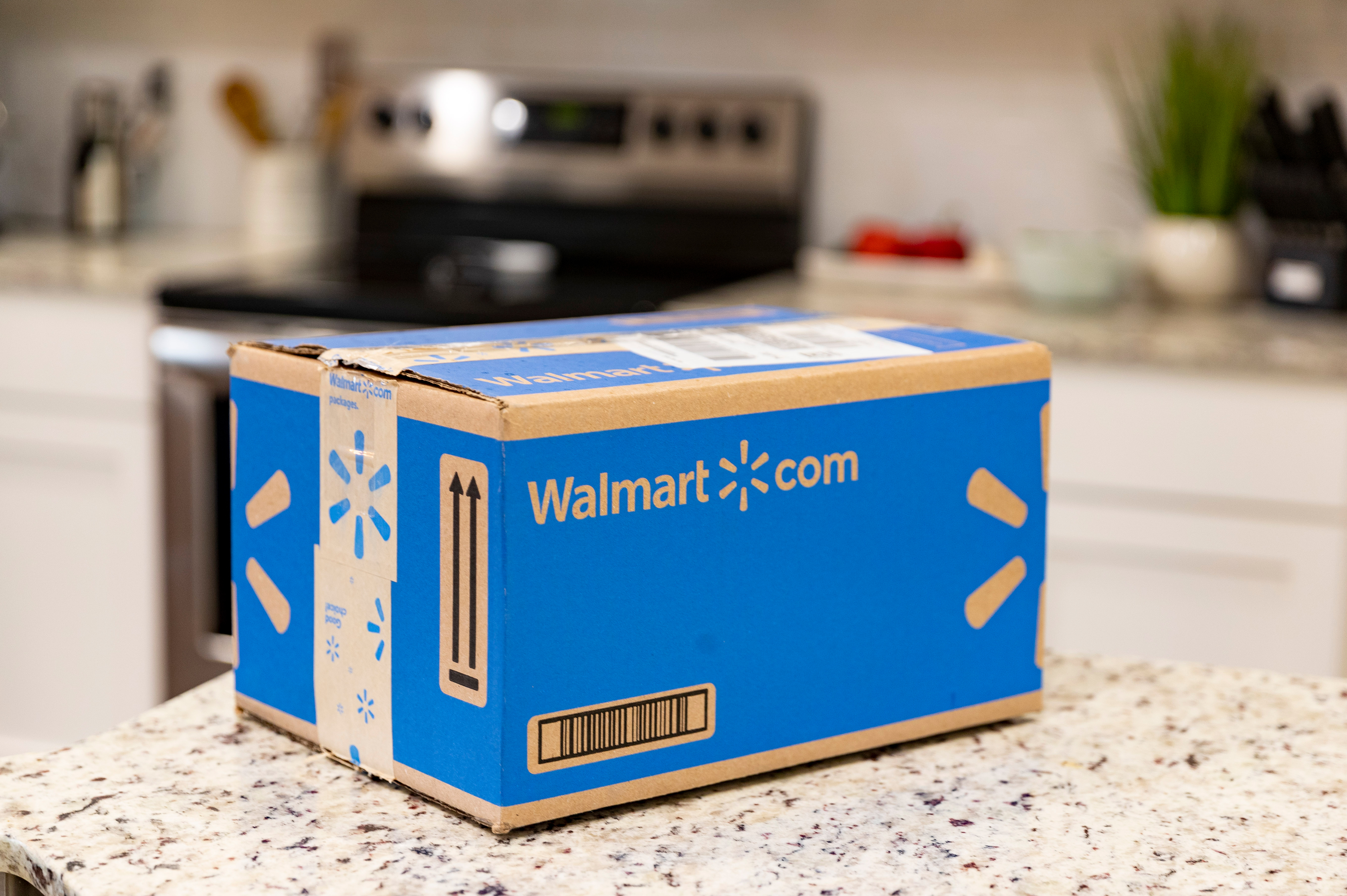 A Walmart.com box sitting on a kitchen counter