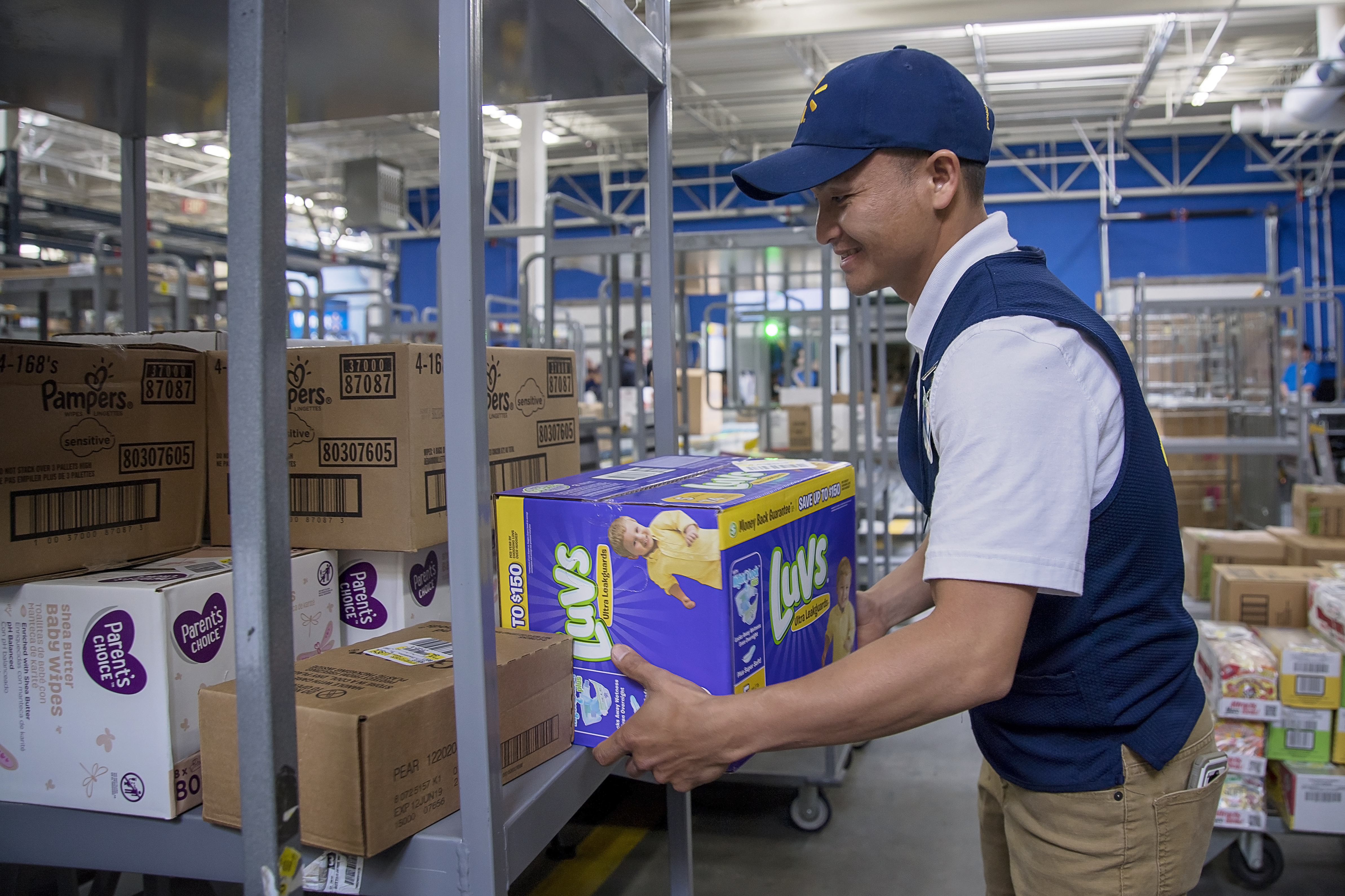 An associate unloads boxes using the new FAST unloading process